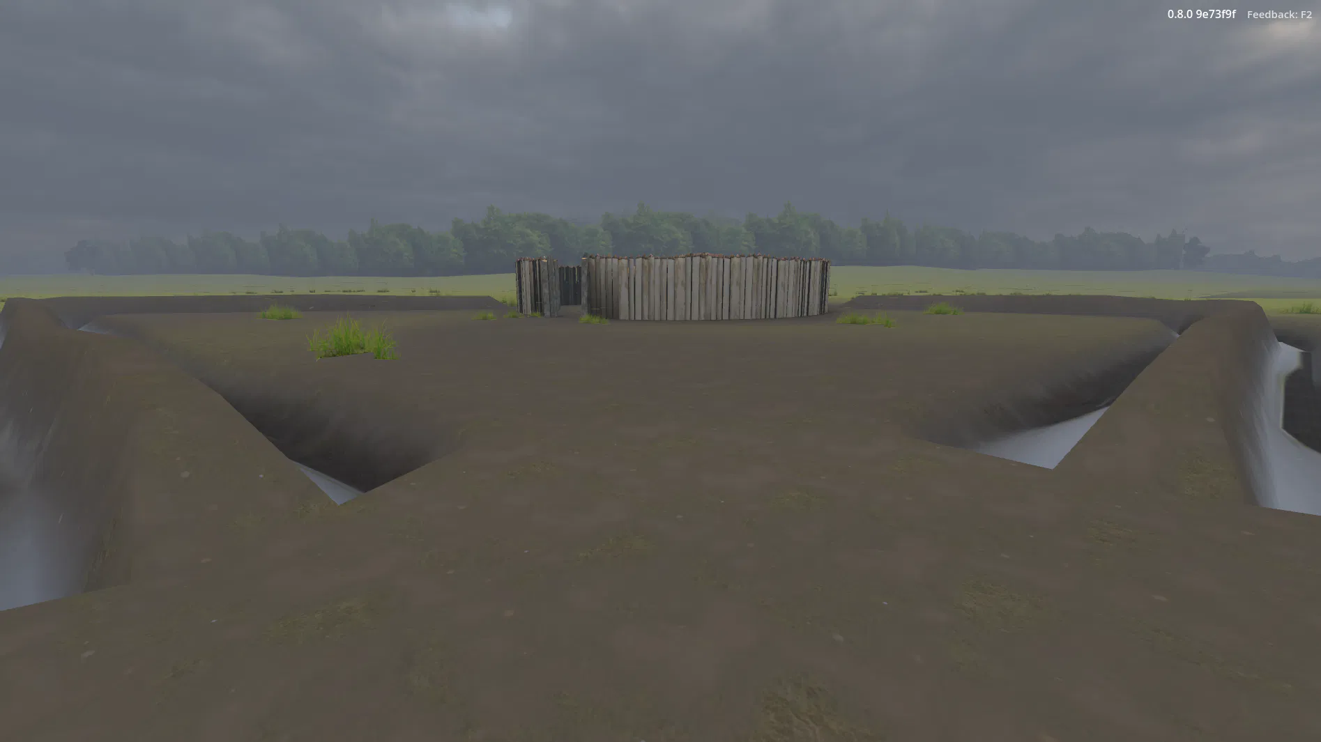 A wide, distant view of Fort Necessity and its outer earthworks, set in the open field of the Great Meadows.